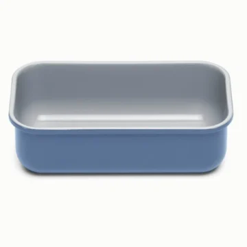 A rectangular 1 ½ quart loaf pan baking dish with light gray interior and blue exterior, placed on a plain white background.