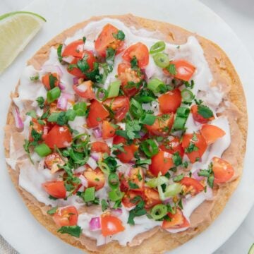 Easy vegan tostada on a white plate