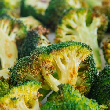 Air fryer broccoli on a white plate.