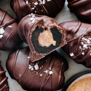 Chocolate covered stuffed dates garnished with flaky sea salt.