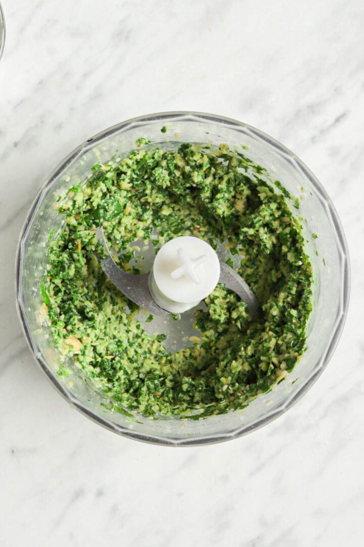 Pesto in a food processor while pulsing.