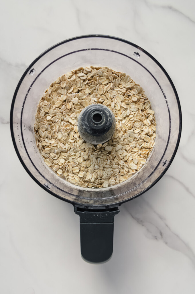 Oats in a food processor prior to processing.