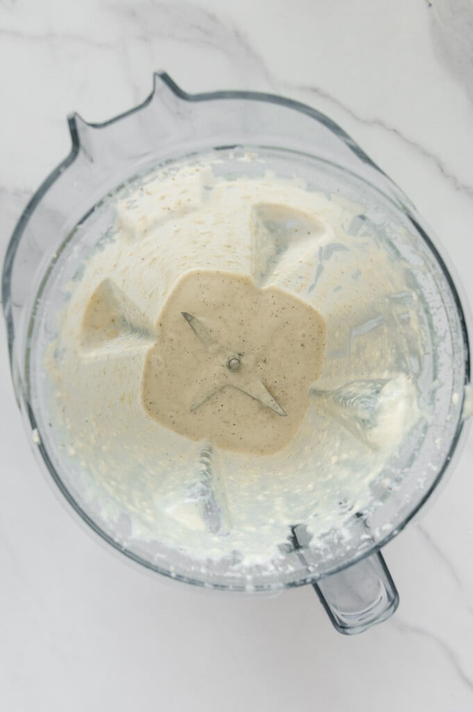 Vegan Italian dressing in a blender prior to adding ice.