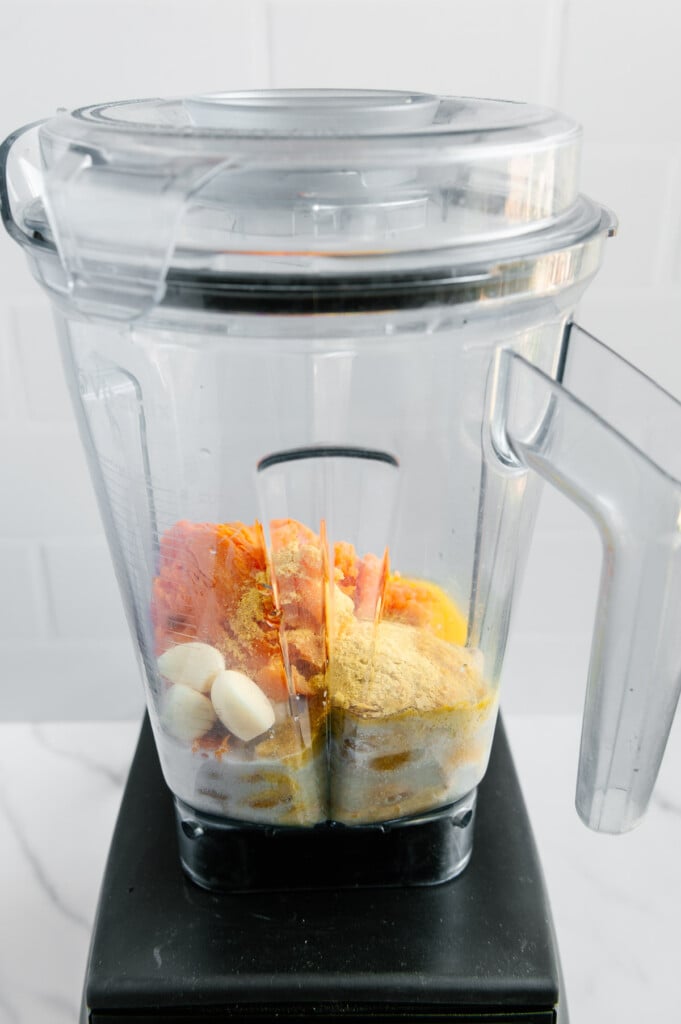 Vegan mac and cheese ingredients in a blender prior to blending.