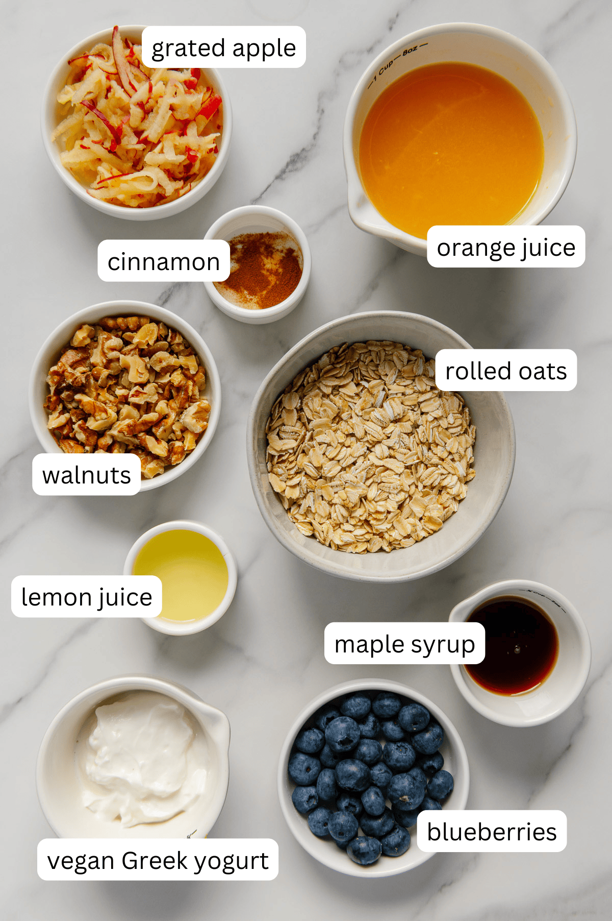 Ingredients of Princess Diana overnight oats with a white marble background.