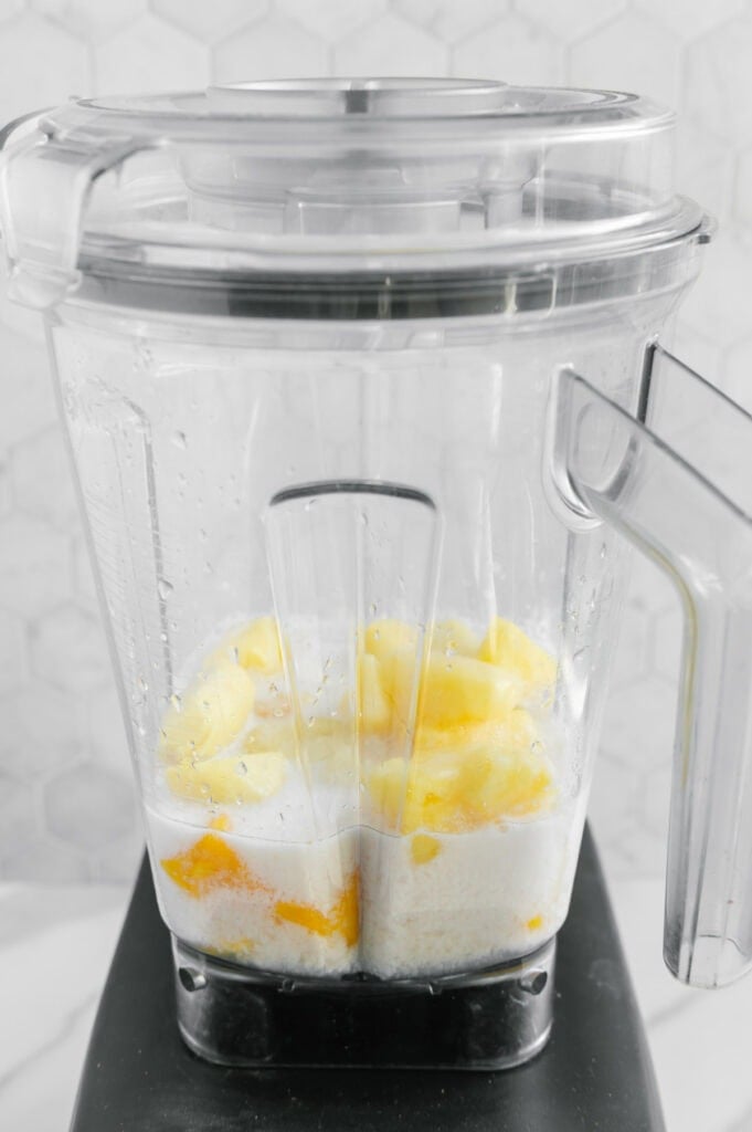 Ingredients of a ginger smoothie in a blender before blending.